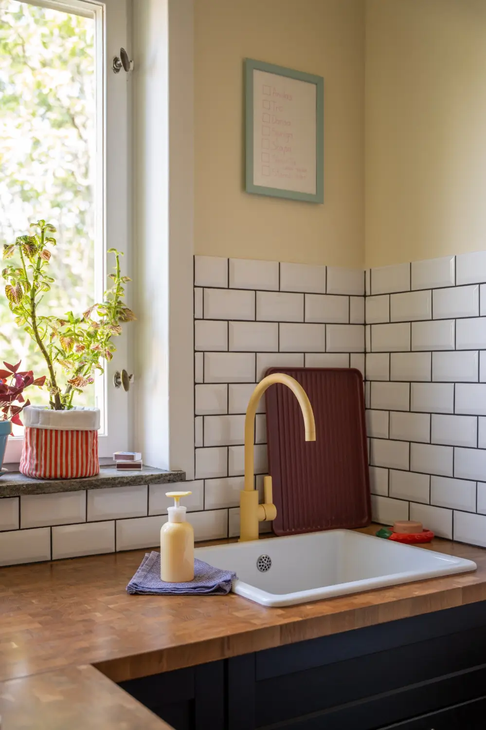 Cheerful Colors in a Small & Light 1940s Apartment in Stockholm 24 yellow-faucet-kitchen-nordroom