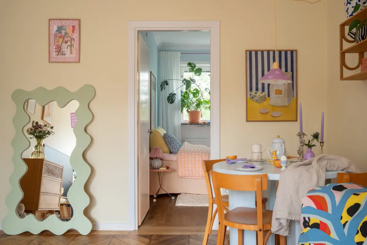 Cheerful Colors in a Small & Light 1940s Apartment in Stockholm 15 yellow living room view into bedroom