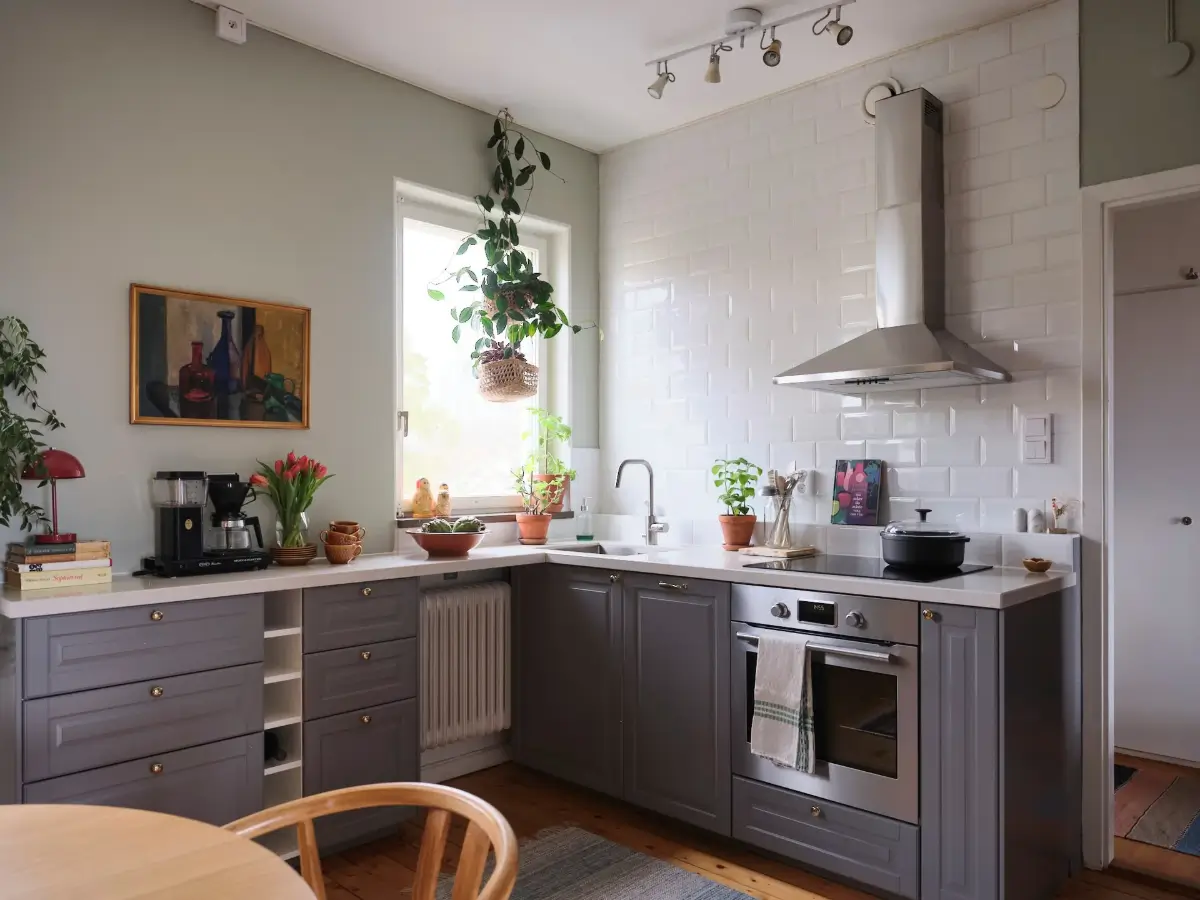 Green Tones, Plants, and Midcentury Design in a 1940s Apartment 9 1940-apartment-spacious-kitchen-nordroom