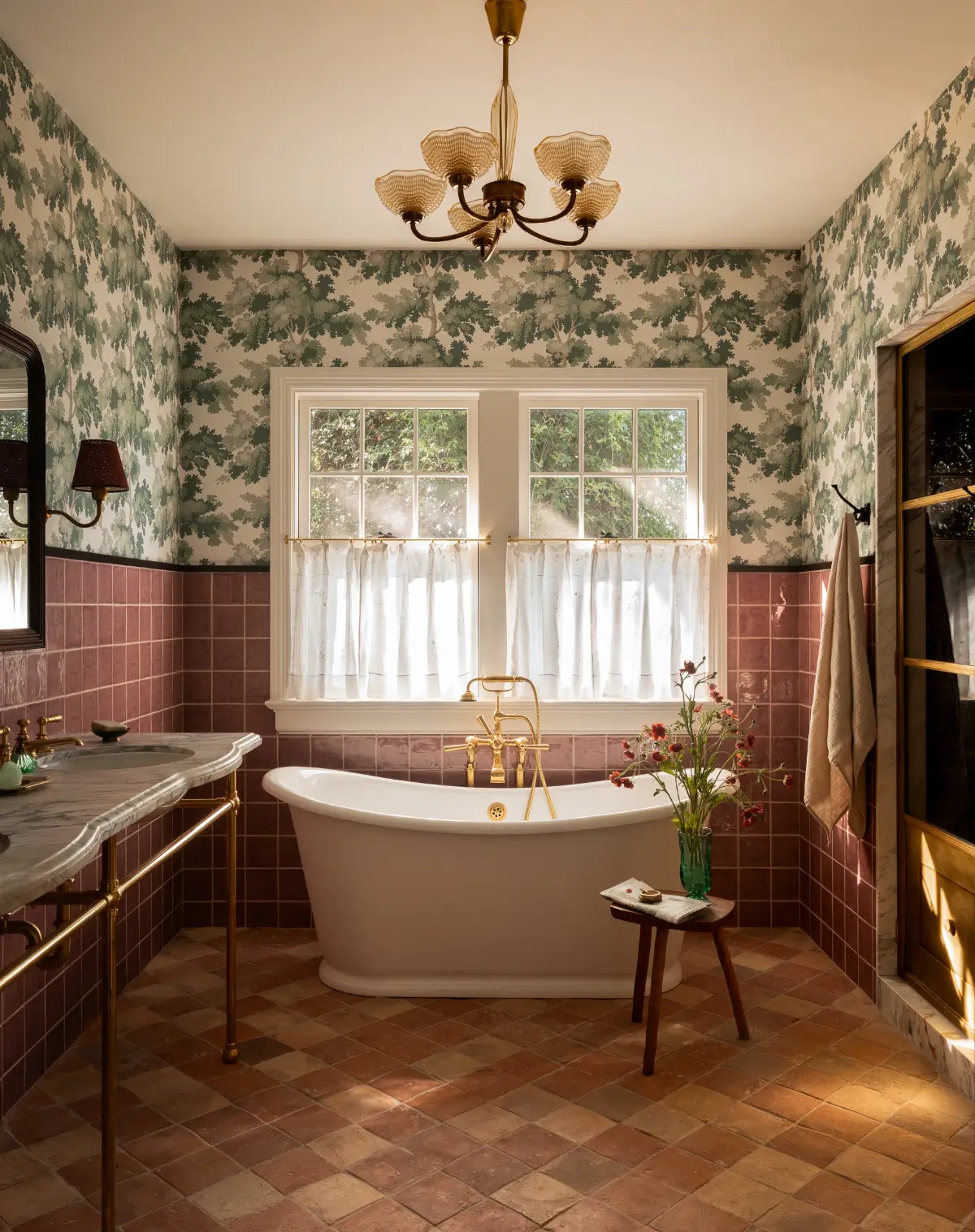 bathroom-freestanding-bath-pink-tiles-green-botanical-wallpaper-terracotta-floor