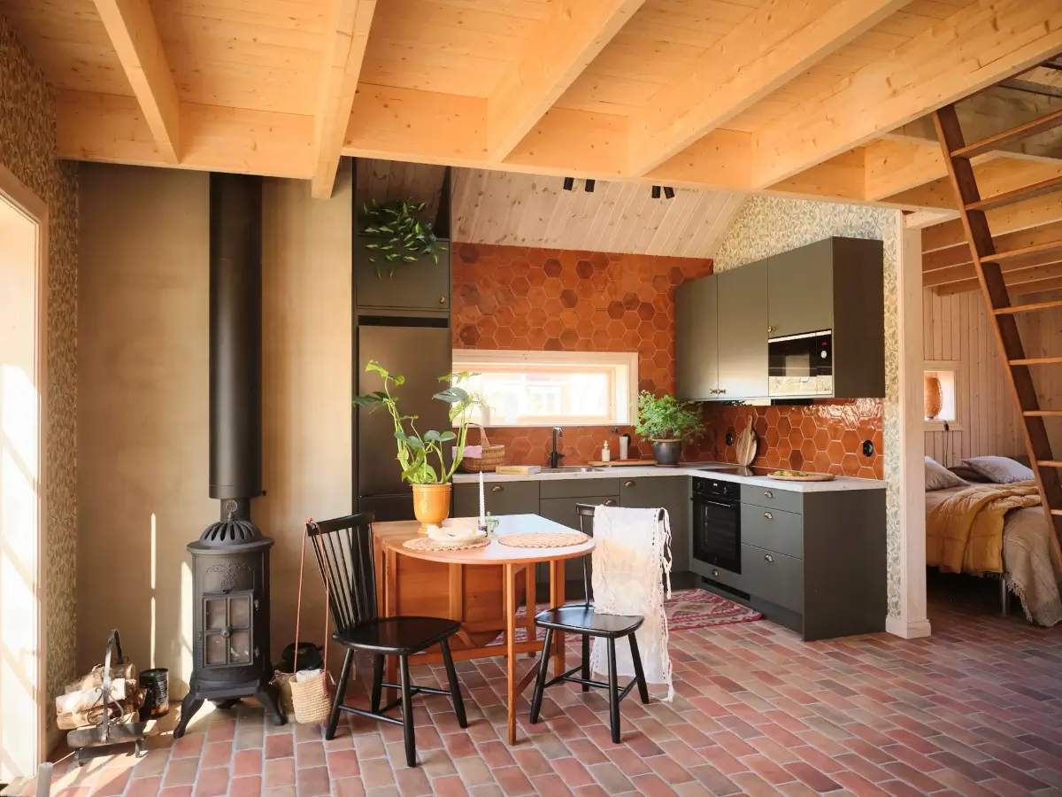 A Cozy Wooden Guest House with a Brick Floor at a Swedish Country Estate 2 cozy-guesthouse-stone-floor-wallpaper-swedish-island-home-nordroom