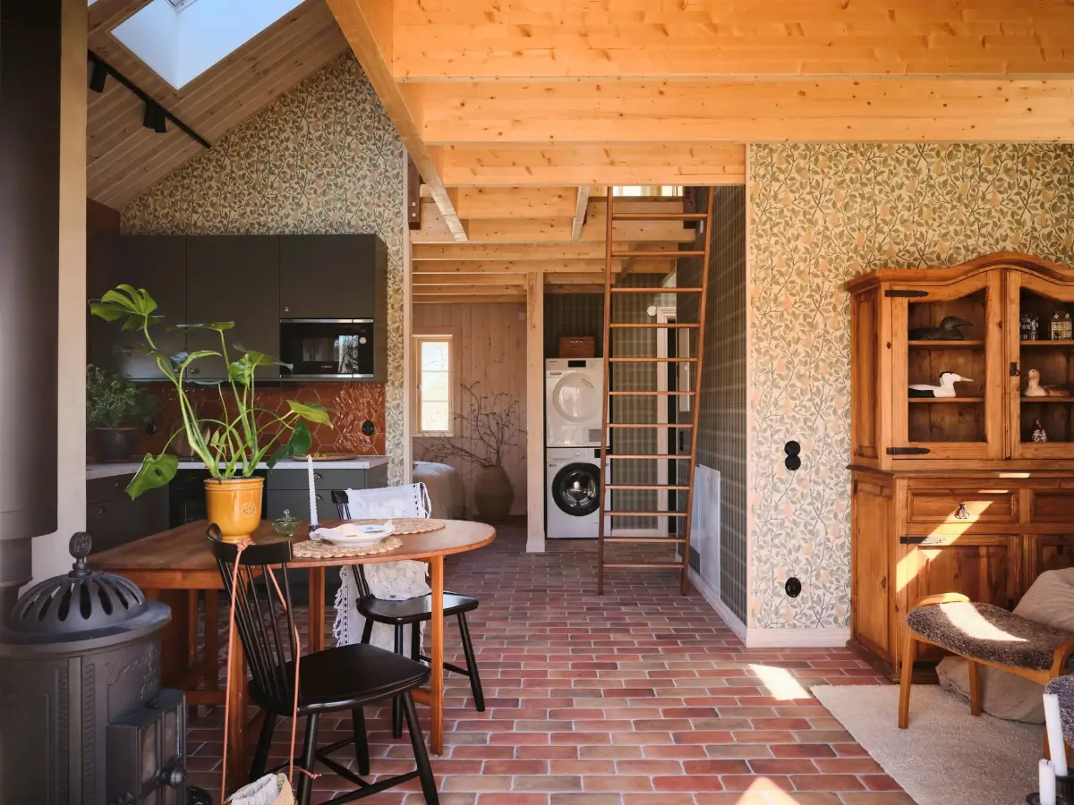 A Cozy Wooden Guest House with a Brick Floor at a Swedish Country Estate 8 cozy-guesthouse-stone-floor-wallpaper-swedish-island-home-nordroom