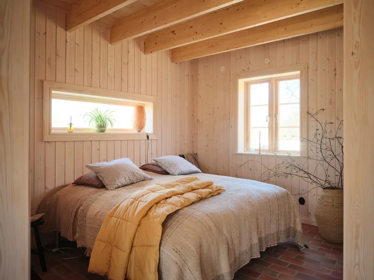 A Cozy Wooden Guest House with a Brick Floor at a Swedish Country Estate 10 cozy-guesthouse-stone-floor-wallpaper-swedish-island-home-nordroom