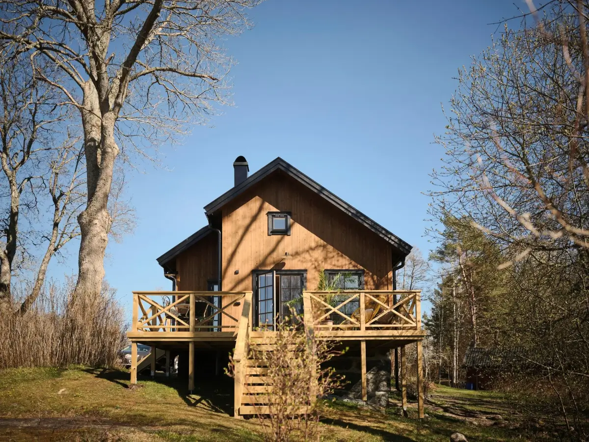 A Cozy Wooden Guest House with a Brick Floor at a Swedish Country Estate 1 cozy-guesthouse-stone-floor-wallpaper-swedish-island-home-nordroom