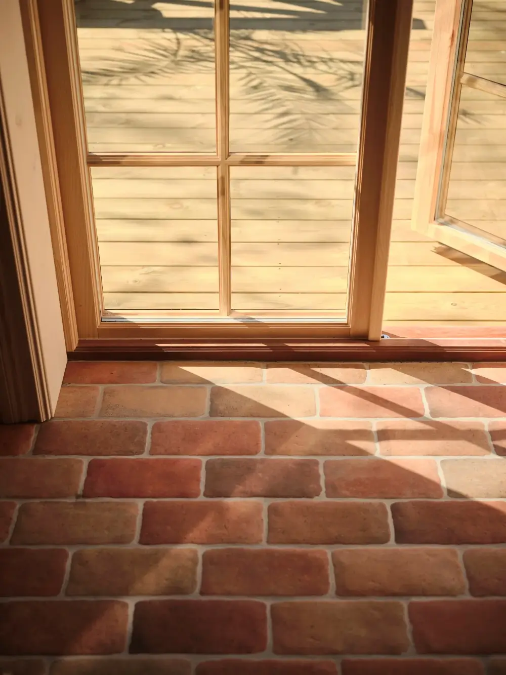 A Cozy Wooden Guest House with a Brick Floor at a Swedish Country Estate 25 cozy-guesthouse-stone-floor-wallpaper-swedish-island-home-nordroom