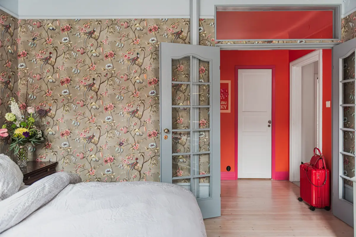 Whimsical Decor and Vibrant Color Accents in a Malmö Apartment 13 floral-wallpaper-bedroom-renovated-swedish-apartment-bold-colored-hall-nordroom