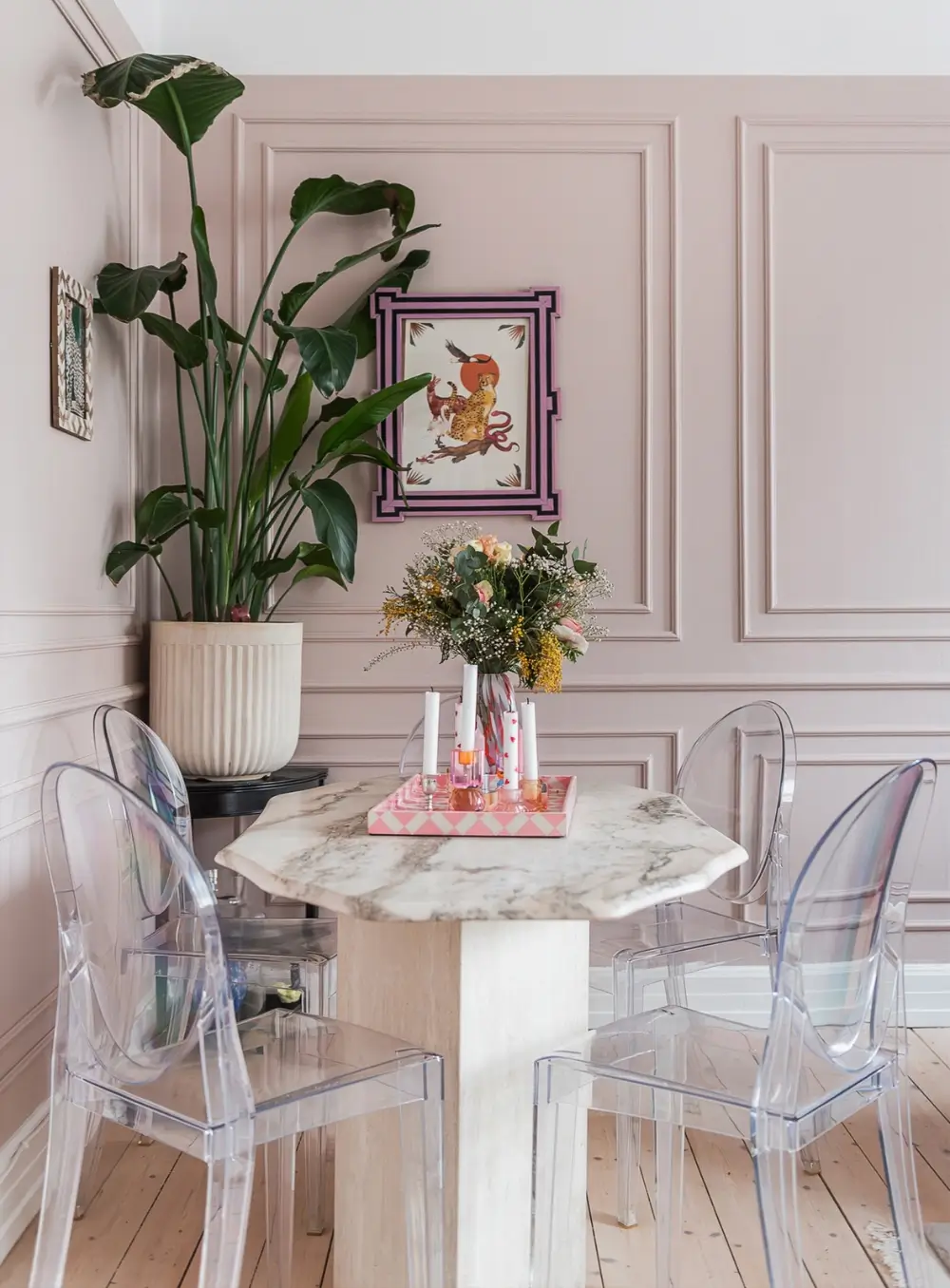 Whimsical Decor and Vibrant Color Accents in a Malmö Apartment 3 pink-living-room-marble-topped-dining-table