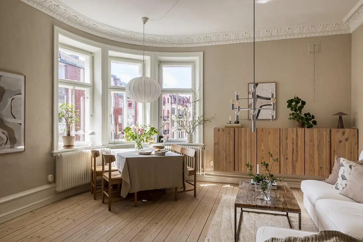 A Green Kitchen, Period Elements, and Jotun Colors in a Small Corner Apartment 1 renovated-late-19th-century-corner-apartment-gothenburg-nordroom