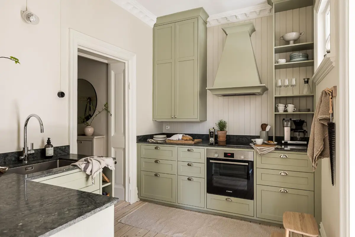 A Green Kitchen, Period Elements, and Jotun Colors in a Small Corner Apartment 8 renovated-late-19th-century-corner-apartment-gothenburg-nordroom