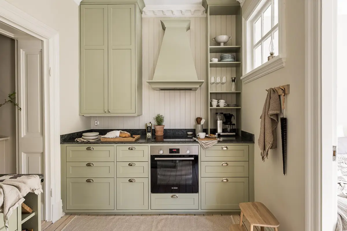 A Green Kitchen, Period Elements, and Jotun Colors in a Small Corner Apartment 9 renovated-late-19th-century-corner-apartment-gothenburg-nordroom