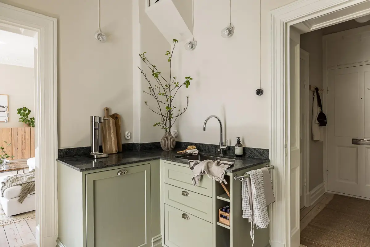 A Green Kitchen, Period Elements, and Jotun Colors in a Small Corner Apartment 13 renovated-late-19th-century-corner-apartment-gothenburg-nordroom