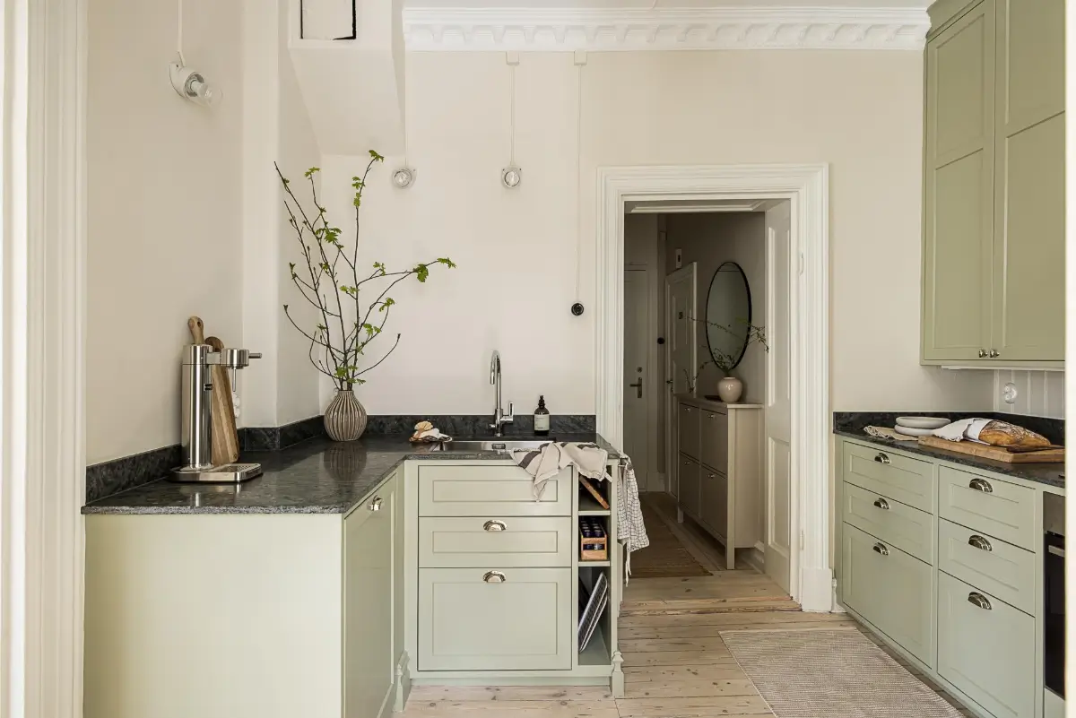 A Green Kitchen, Period Elements, and Jotun Colors in a Small Corner Apartment 11 renovated-late-19th-century-corner-apartment-gothenburg-nordroom
