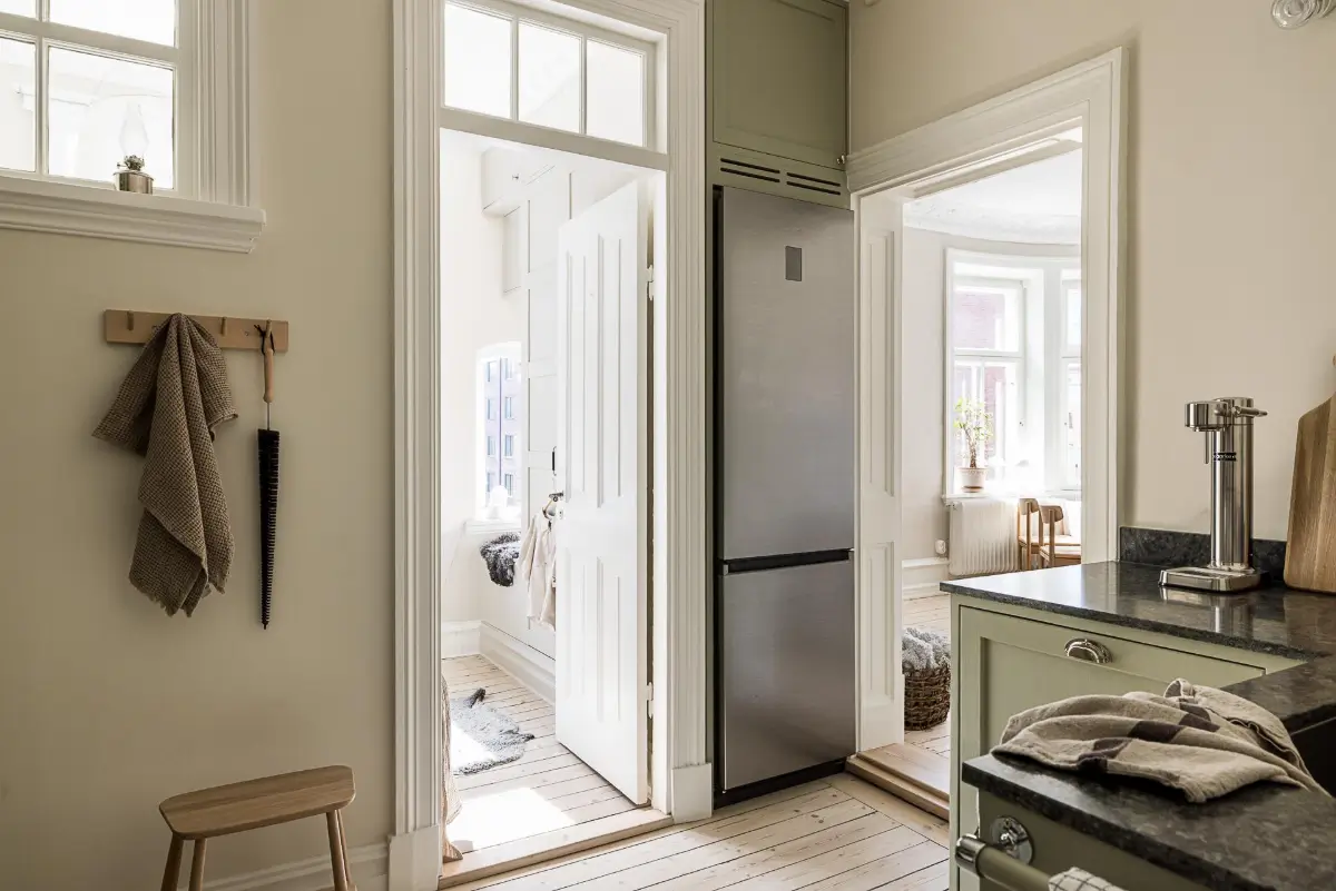 A Green Kitchen, Period Elements, and Jotun Colors in a Small Corner Apartment 15 renovated-late-19th-century-corner-apartment-gothenburg-nordroom