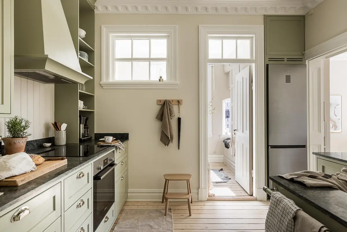 A Green Kitchen, Period Elements, and Jotun Colors in a Small Corner Apartment 14 renovated-late-19th-century-corner-apartment-gothenburg-nordroom