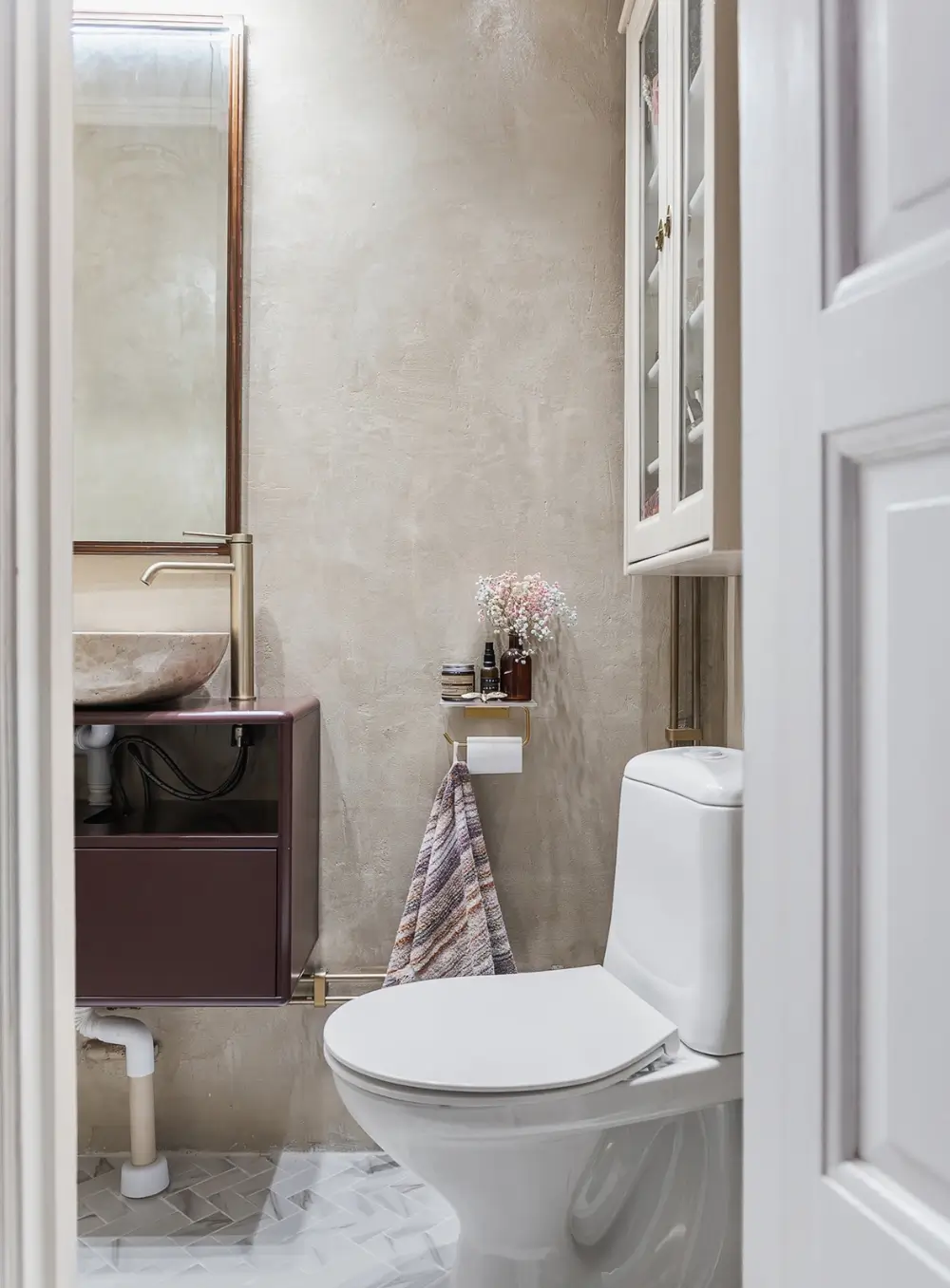 Whimsical Decor and Vibrant Color Accents in a Malmö Apartment 15 small-bathroom-microcement-walls-renovated-swedish-apartment-bold-colored-hall-nordroom