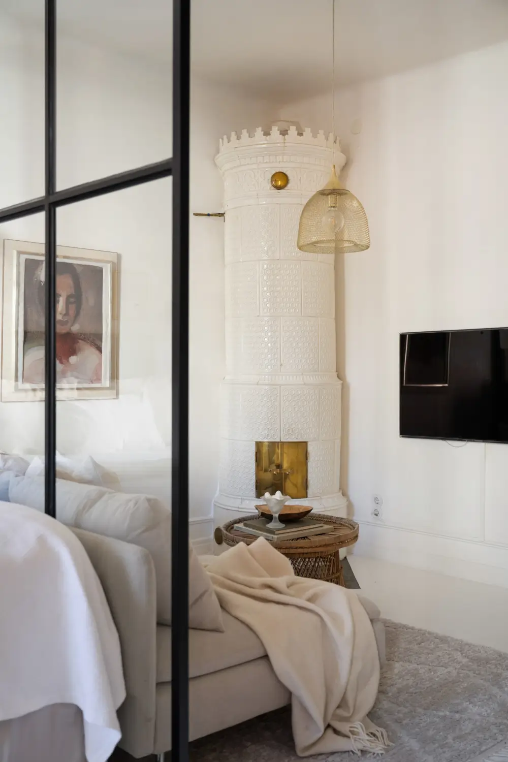 An Elegant Stockholm Apartment Blends Modern Elements with Period Features 21 bright-studio-apartment-industrial-glass-room-divider-lush-balcony
