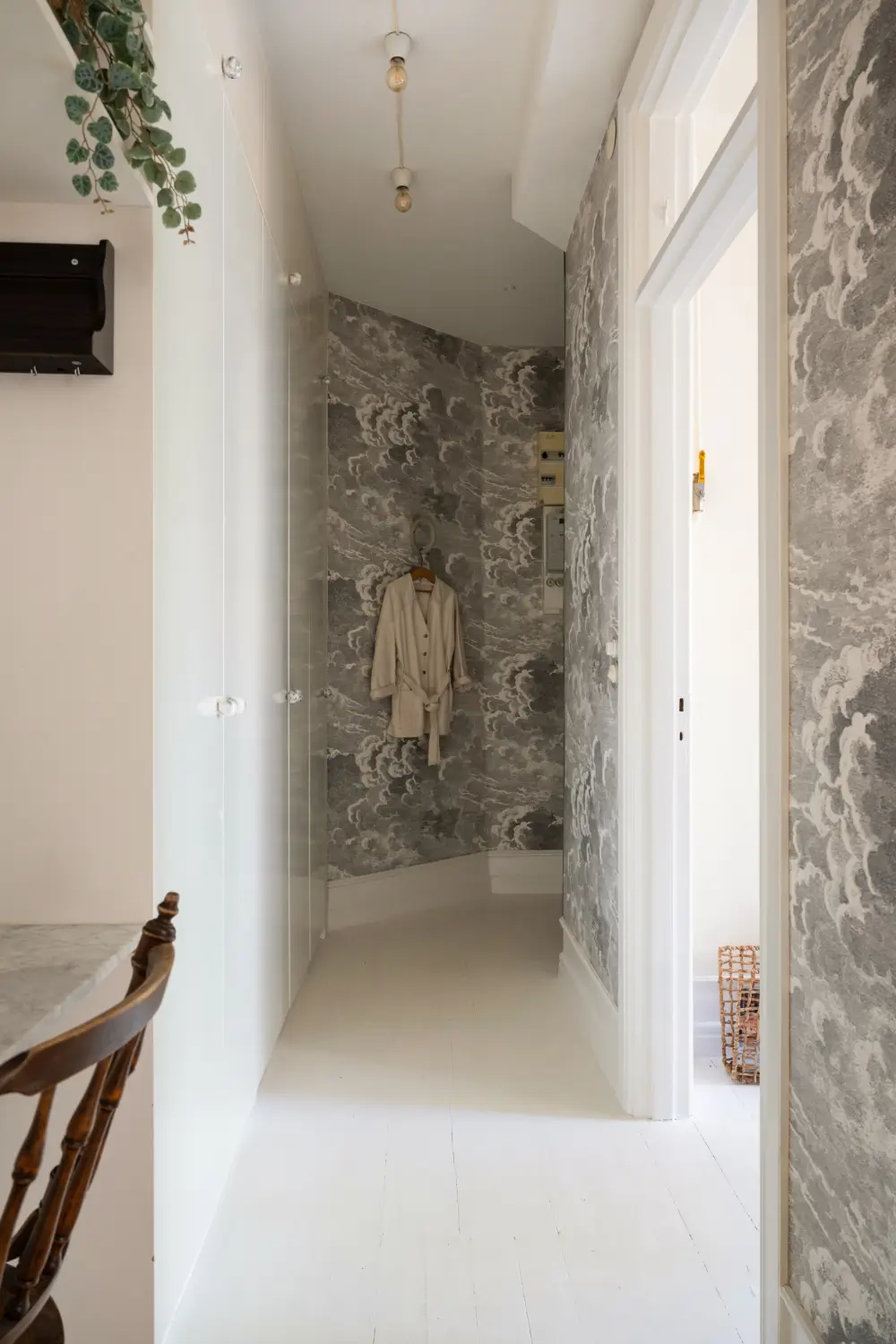 An Elegant Stockholm Apartment Blends Modern Elements with Period Features 31 bright-studio-apartment-industrial-glass-room-divider-lush-balcony