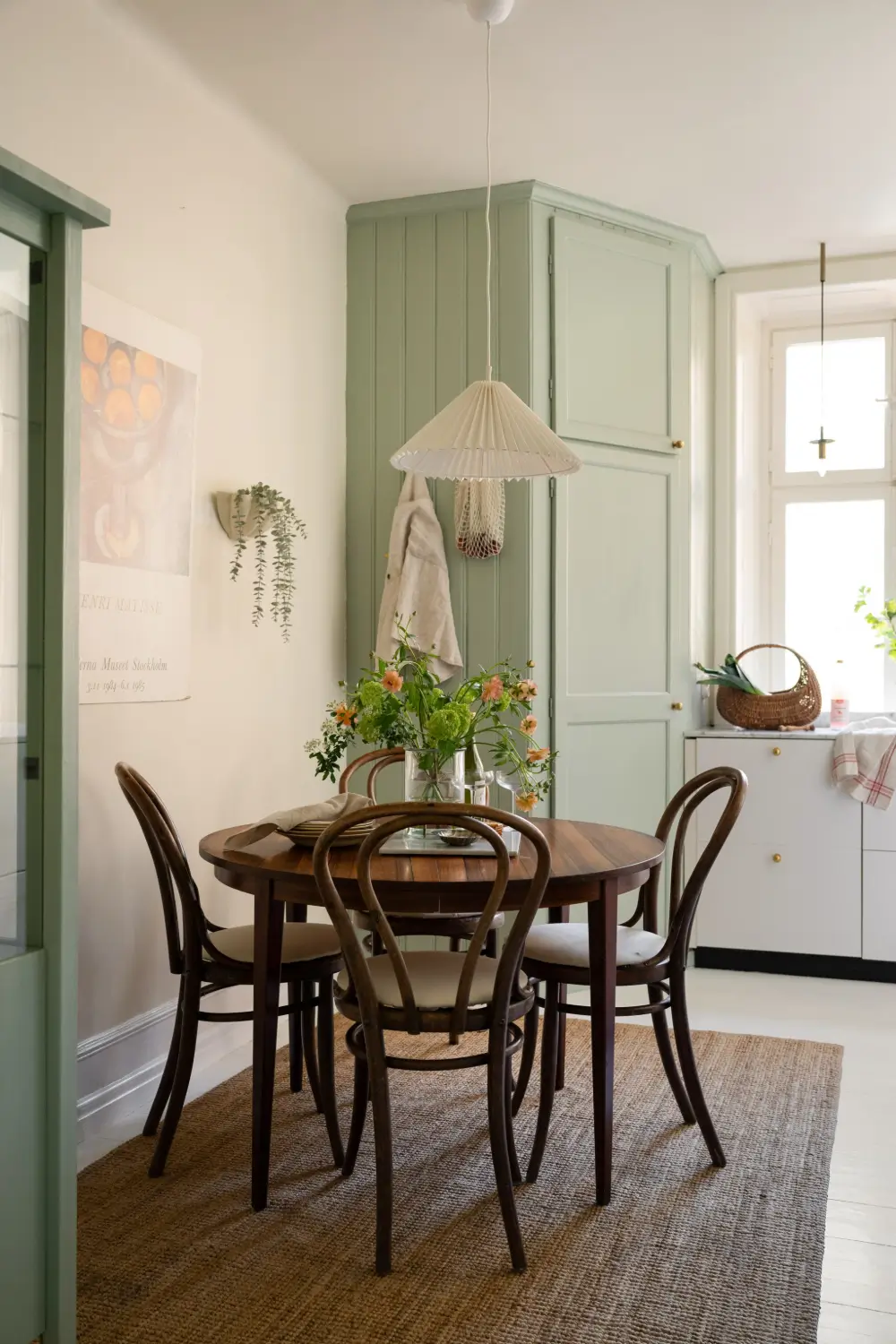 An Elegant Stockholm Apartment Blends Modern Elements with Period Features 2 bright-studio-apartment-industrial-glass-room-divider-lush-balcony