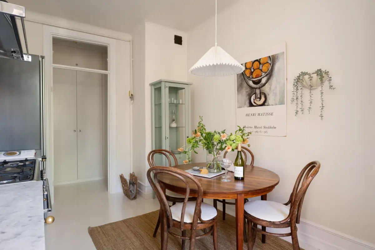 An Elegant Stockholm Apartment Blends Modern Elements with Period Features 10 bright-studio-apartment-industrial-glass-room-divider-lush-balcony