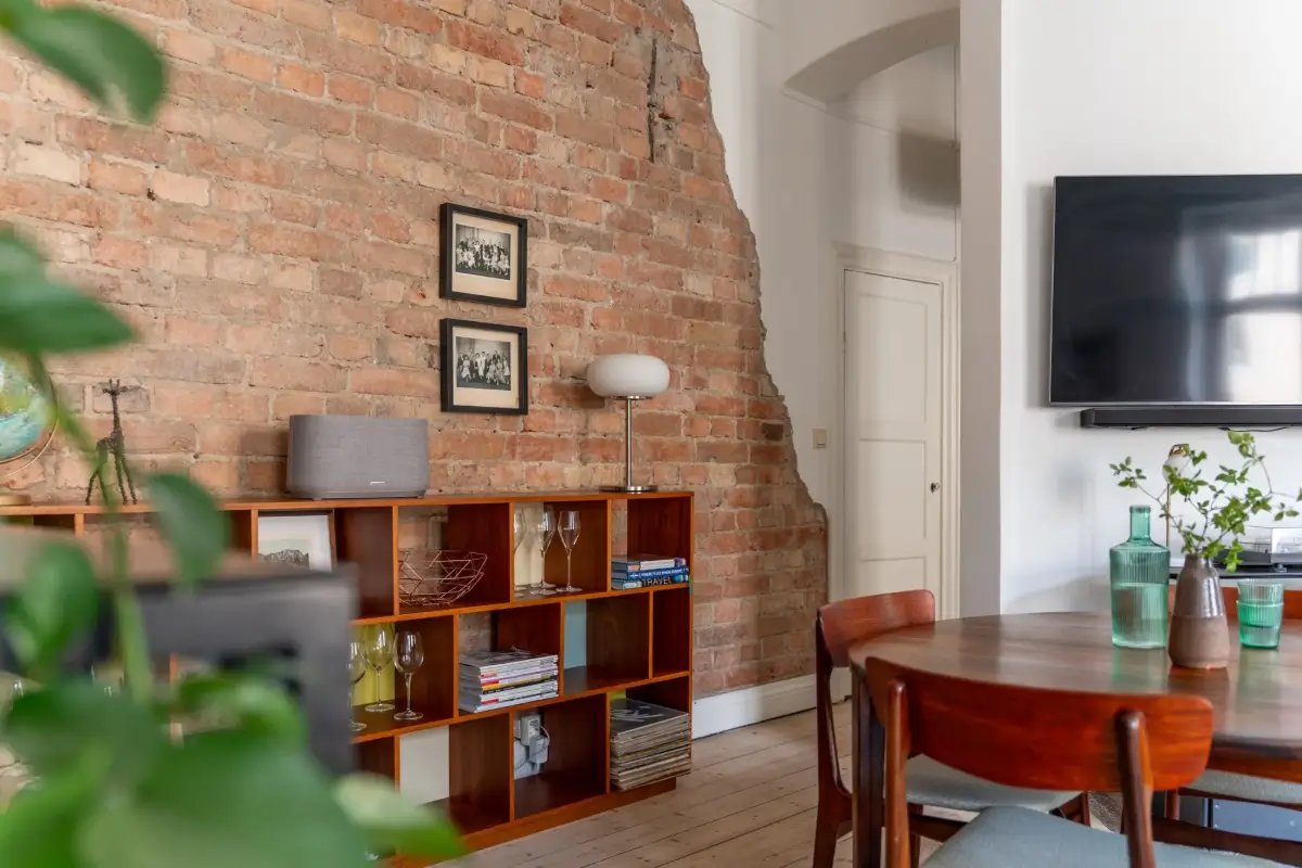 A Social Living Space and an Exposed Brick Wall in a Stockholm Apartment 7 classic-turn-of-the-century-stockholm-apartment-nordroom