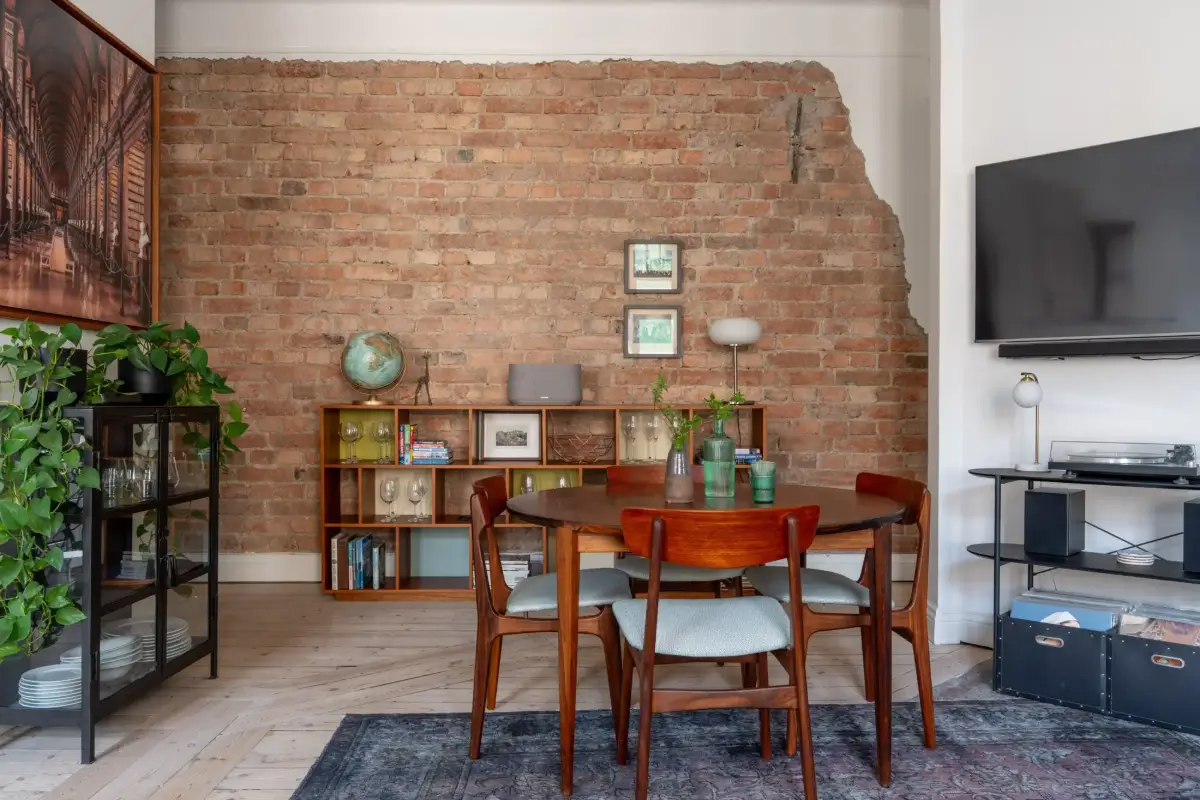 A Social Living Space and an Exposed Brick Wall in a Stockholm Apartment 6 classic-turn-of-the-century-stockholm-apartment-nordroom