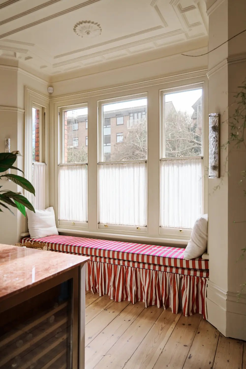 Trend Alert: The 'Soft Kitchen' is 2026's Coziest Interior Trend and It's Here to Stay 17 kitchen-built-in-window-bench-striped-upholstery-nordroom