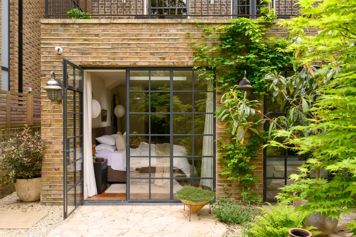 A Bedroom Connected to Nature in a Luxurious Notting Hill Duplex Garden Apartment 13 luxurious-notting-hill-duplex-apartment-garden