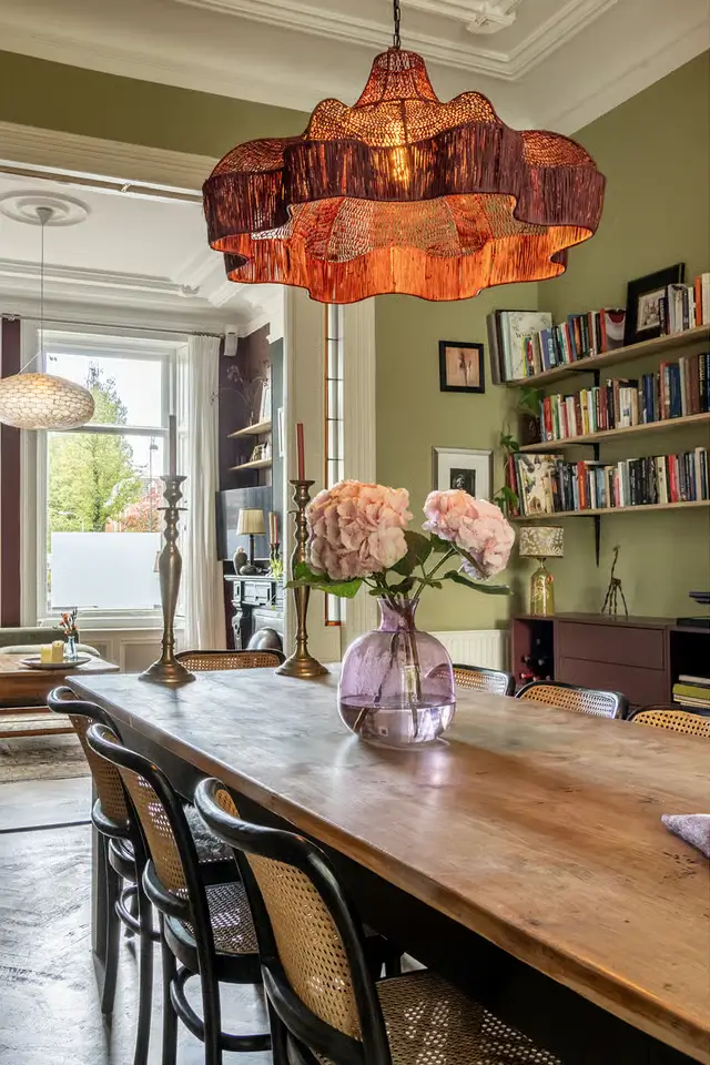 This Retro Color Could Add $2,277 to Your Home's Value (Another Could Cost You $18,000) 4 sage green dining room rustic table nordroom This Retro Color Could Add $2,277 to Your Home's Value (Another Could Cost You $18,000)