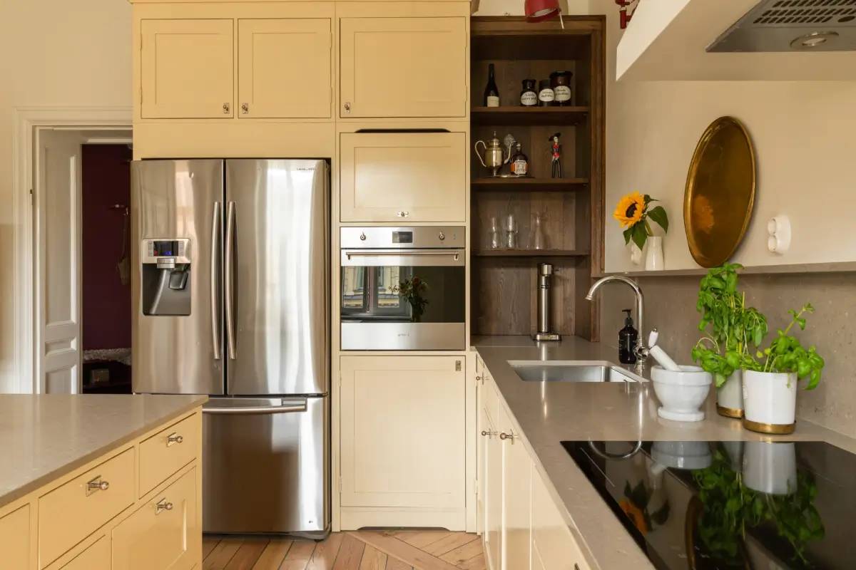 A Rich Burgundy Hall in a Stylishly Renovated Stockholm Apartment 16 butter-yellow-kitchen-period-character-stockholm-apartment-nordroom