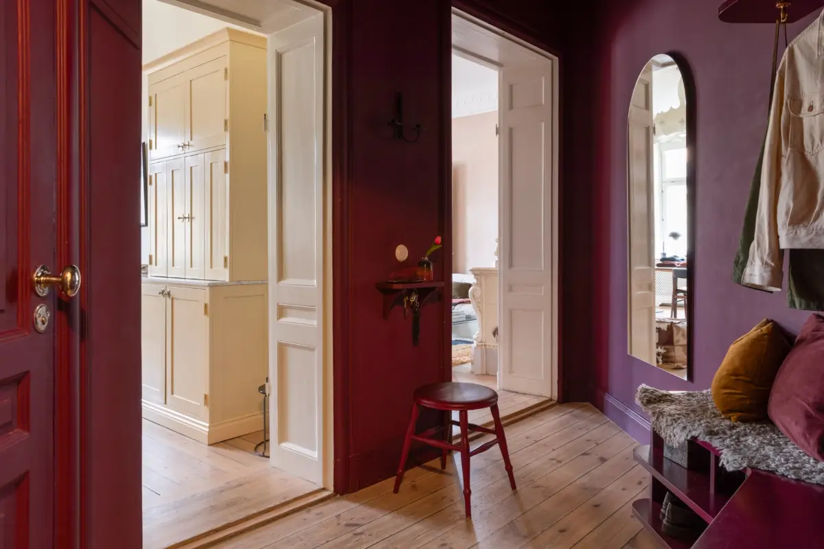 A Rich Burgundy Hall in a Stylishly Renovated Stockholm Apartment 31 butter-yellow-kitchen-period-character-stockholm-apartment-nordroom