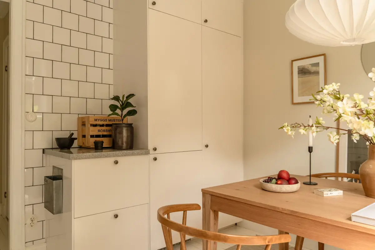 A Dividing Wall with Flea Market Windows Creates a Cozy Sleeping Niche in this Apartment 29 light-filled-turn-of-the-century-apartment-stockholm-nordroom