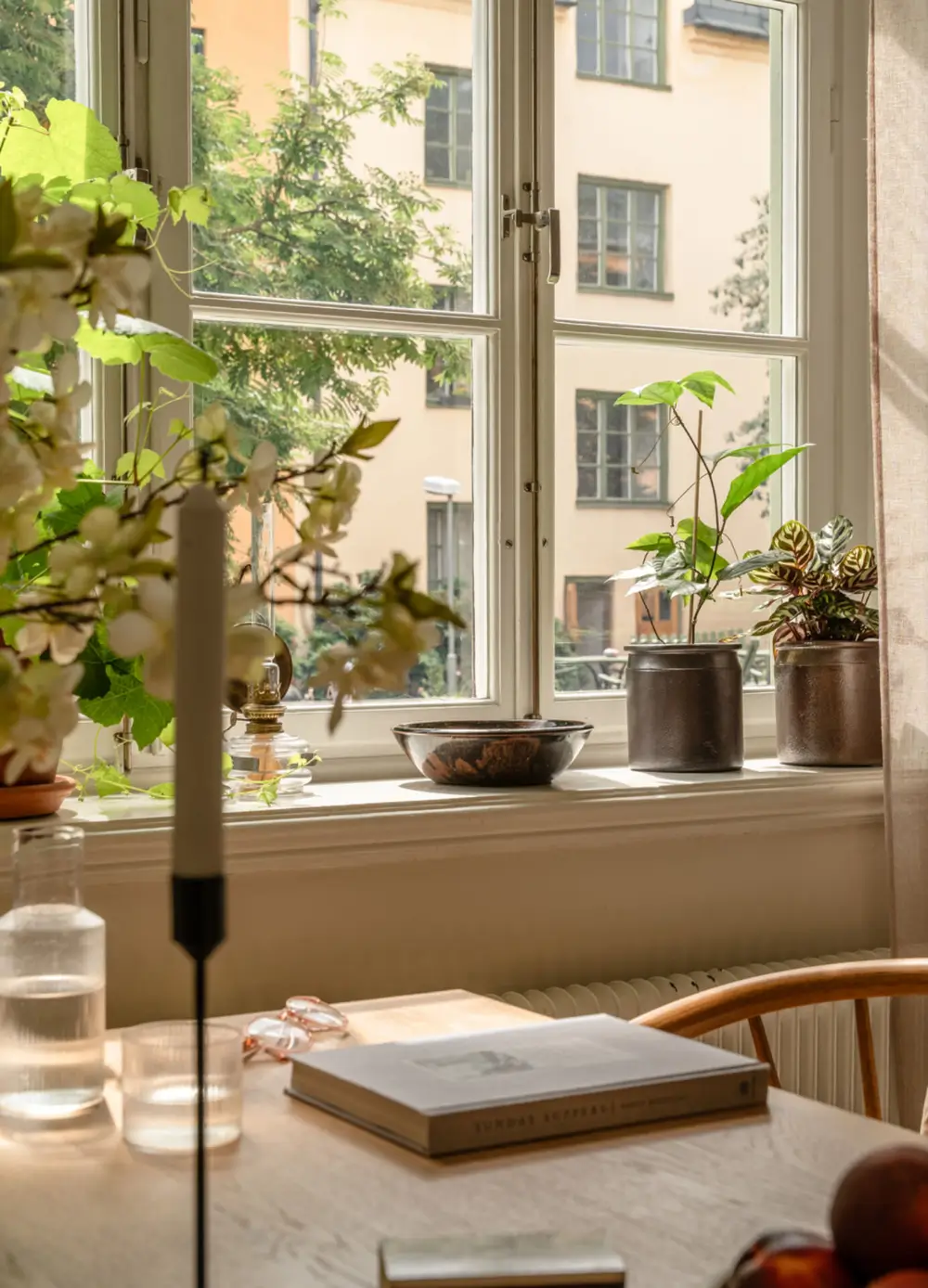 A Dividing Wall with Flea Market Windows Creates a Cozy Sleeping Niche in this Apartment 19 light-filled-turn-of-the-century-apartment-stockholm-nordroom