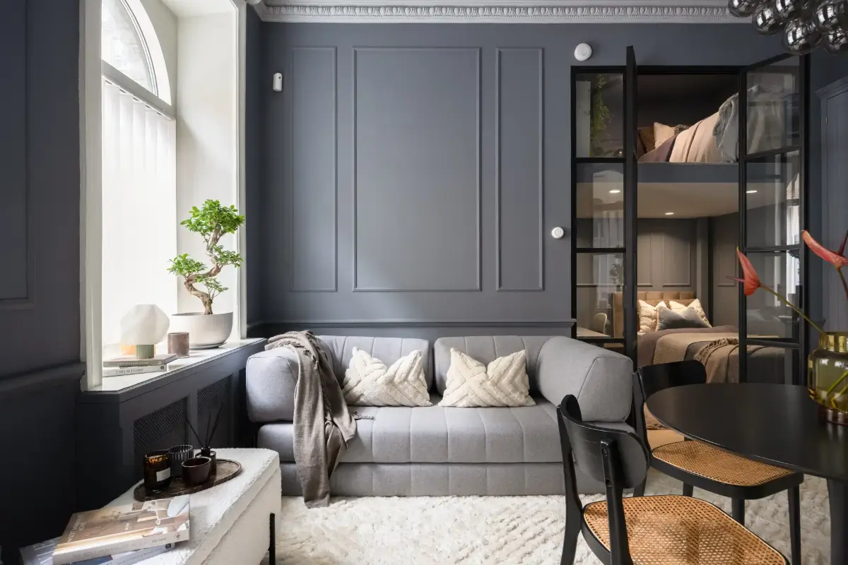 An Industrial Glass Wall Turns a Studio into a One-Bedroom Apartment 8 blue-studio-apartment-industrial-doors-loft-area-nordroom