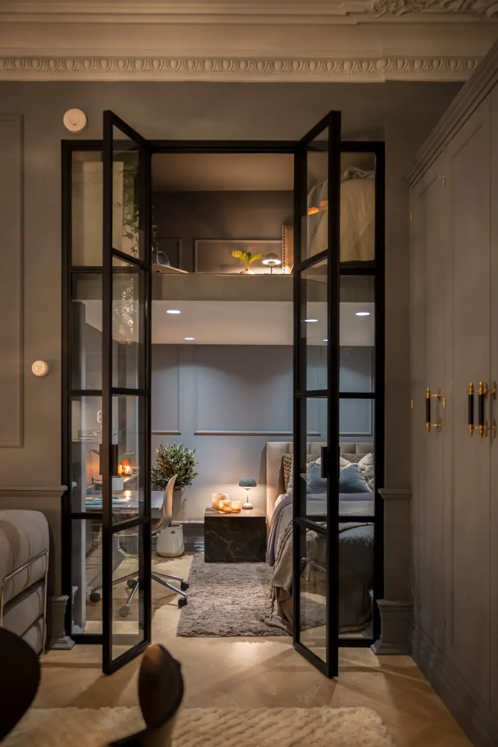 An Industrial Glass Wall Turns a Studio into a One-Bedroom Apartment 15 blue-studio-apartment-industrial-doors-loft-area-nordroom