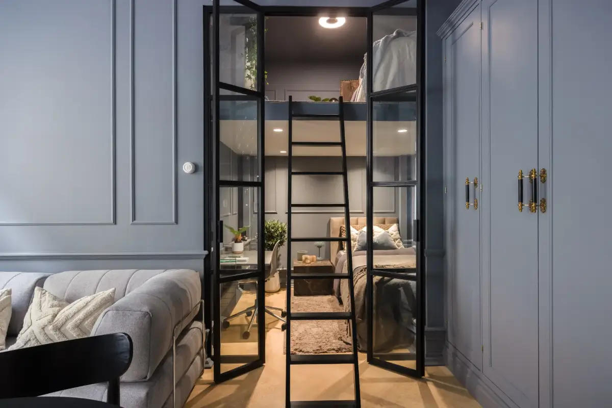 An Industrial Glass Wall Turns a Studio into a One-Bedroom Apartment 19 blue-studio-apartment-industrial-doors-loft-area-nordroom