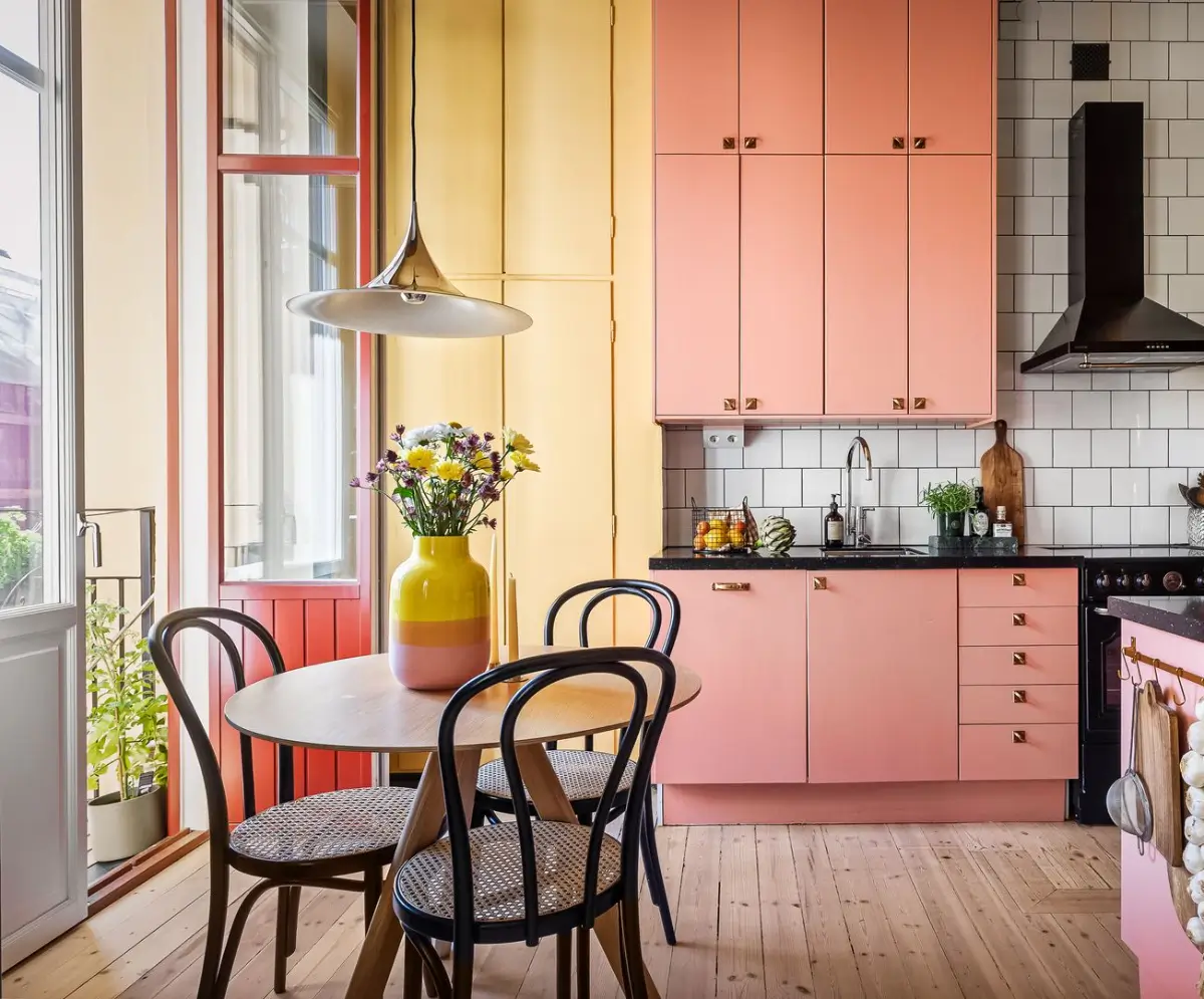 A Pink and Yellow Kitchen in a Colorful Turn-of-the-Century Studio Apartment 6 stockholm-studio-apartment-pink-yellow-kitchen-nordroom