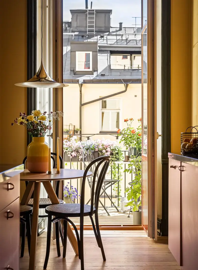 A Pink and Yellow Kitchen in a Colorful Turn-of-the-Century Studio Apartment 9 stockholm-studio-apartment-pink-yellow-kitchen-nordroom