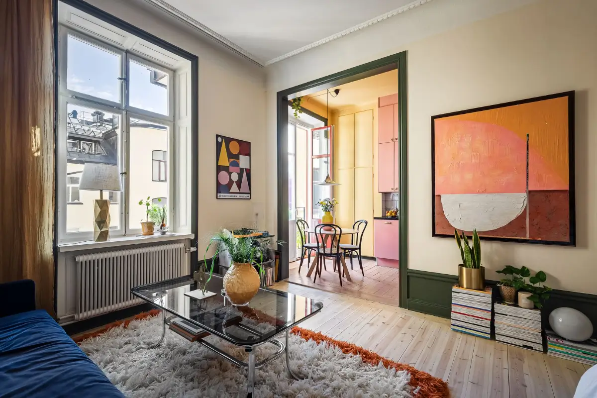 A Pink and Yellow Kitchen in a Colorful Turn-of-the-Century Studio Apartment
