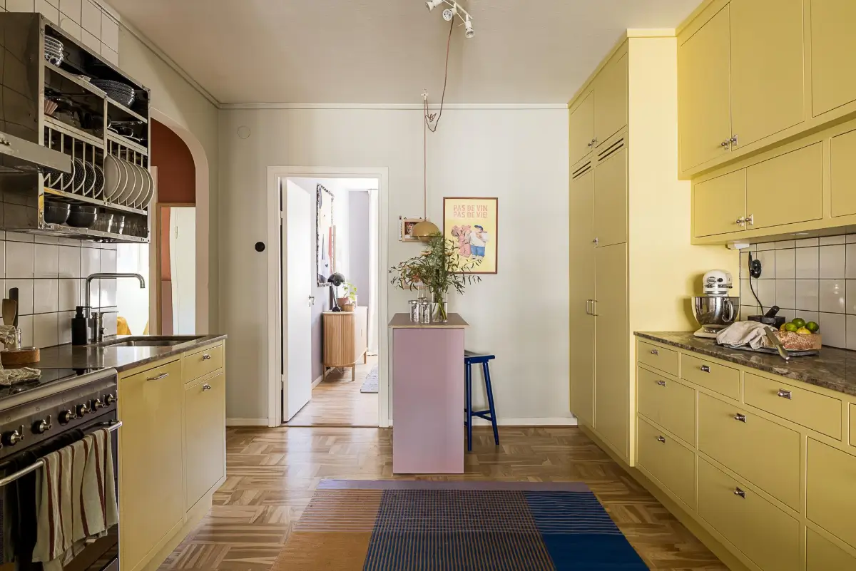 Original Features in a Colorful Midcentury Apartment in Sweden 13 yellow-kitchen-original-features-1940s-apartment-nordroom
