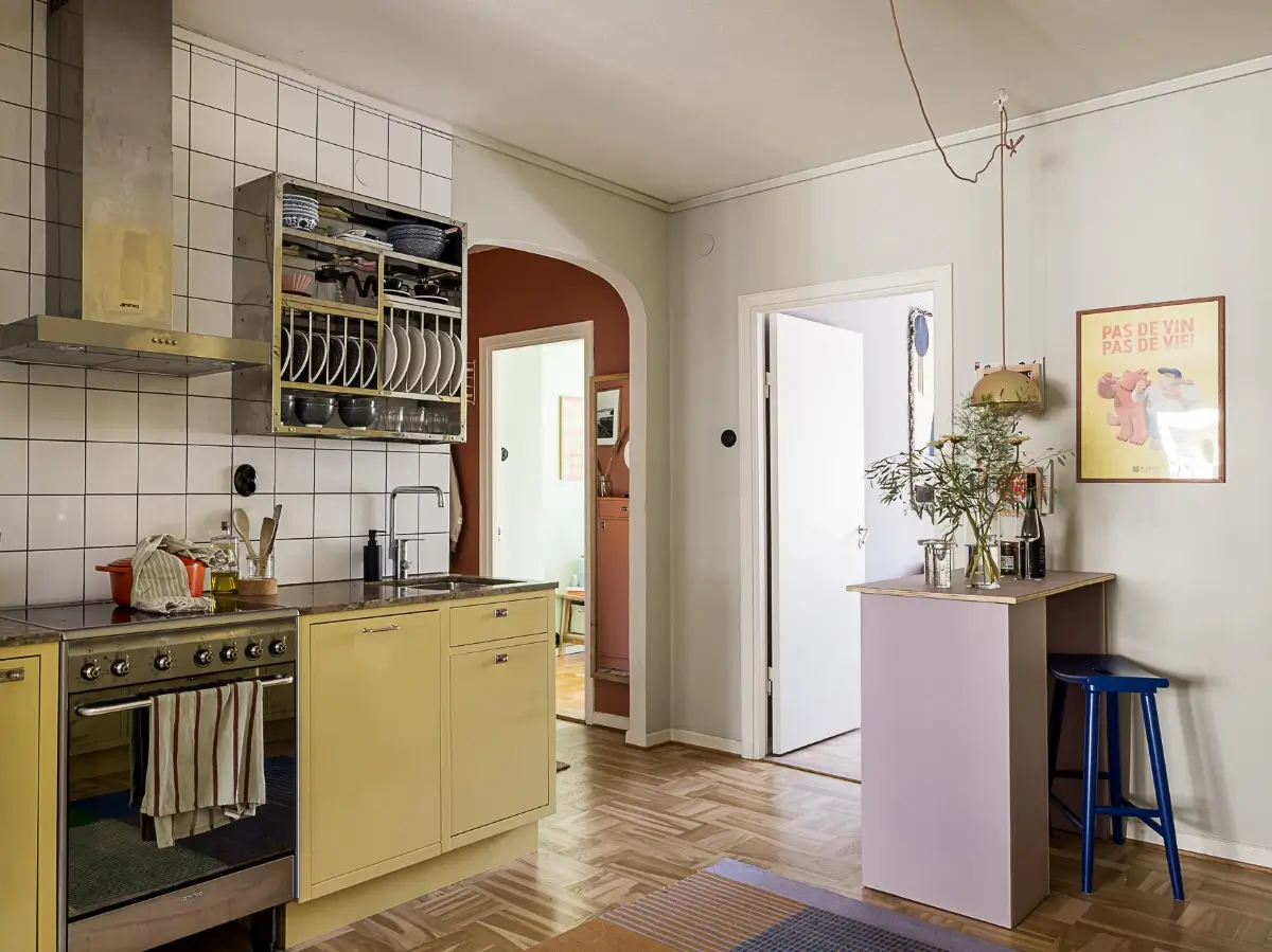Original Features in a Colorful Midcentury Apartment in Sweden 18 yellow-kitchen-original-features-1940s-apartment-nordroom
