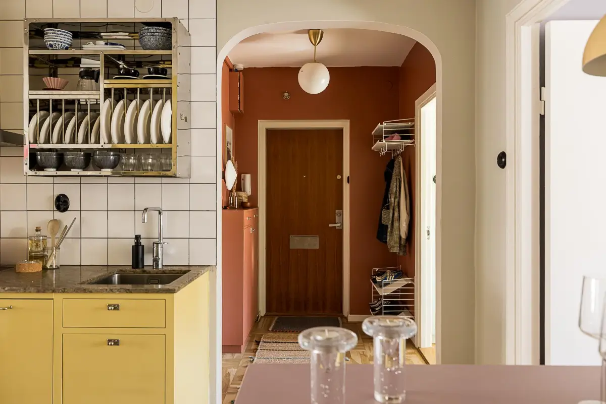 Original Features in a Colorful Midcentury Apartment in Sweden 19 yellow-kitchen-original-features-1940s-apartment-nordroom