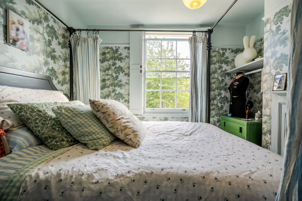 A London Family Home with a Pink deVOL Kitchen and Mint-Green Floorboards 9 bedroom-canopy-bed-botanical-wallpaper-large-window