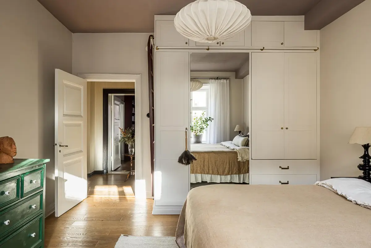 Before & After: A Warm Color Palette and Built-In Bookshelves for a Swedish Home 31 before-and-after-warm-cohesive-color-palette-renovated-turn-of-the-century-apartment-nordroom