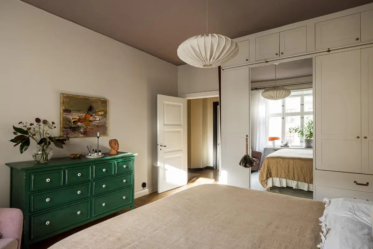Before & After: A Warm Color Palette and Built-In Bookshelves for a Swedish Home 32 before-and-after-warm-cohesive-color-palette-renovated-turn-of-the-century-apartment-nordroom