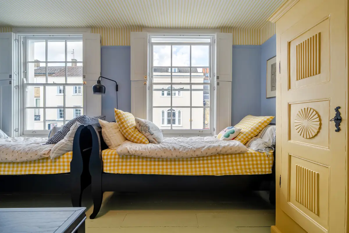 A London Family Home with a Pink deVOL Kitchen and Mint-Green Floorboards 12 blue-yellow-childrens-room-painted-floorboards-striped-ceiling