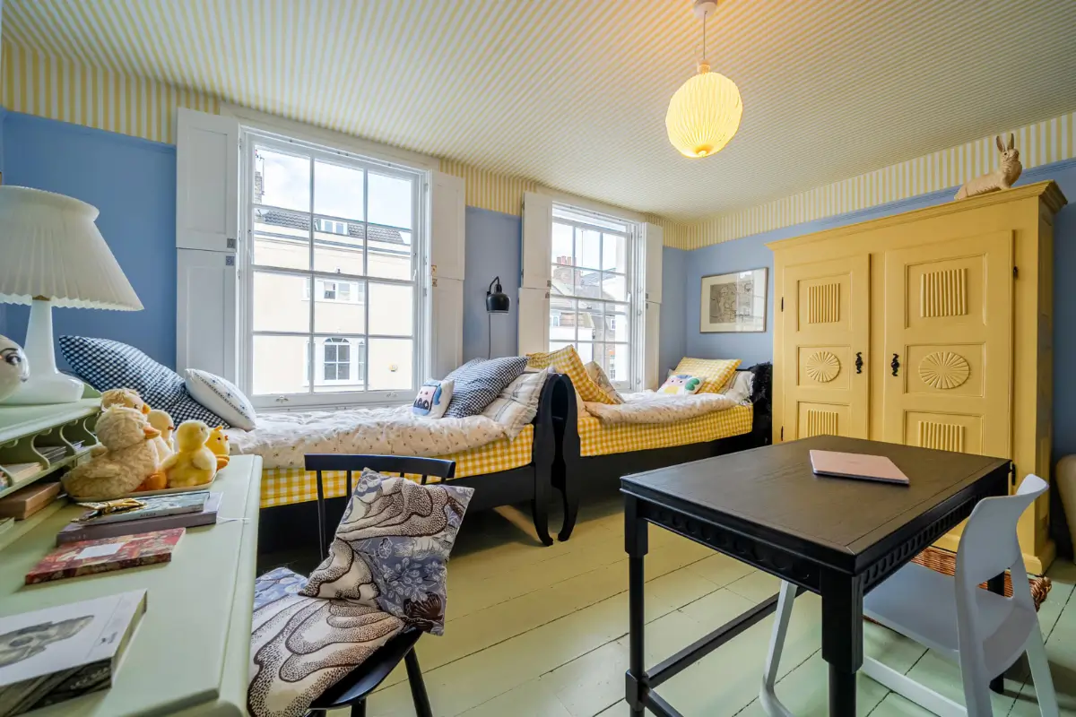 A London Family Home with a Pink deVOL Kitchen and Mint-Green Floorboards 11 colorful-shared-childrens-room-large-windows