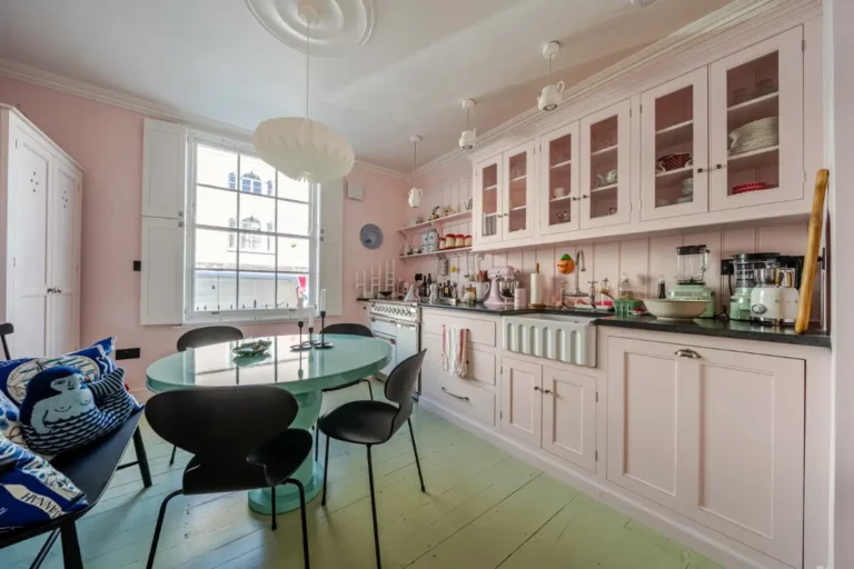 devol-kitchen-pink-cabinets-butler-sink-mint-green-floorboards