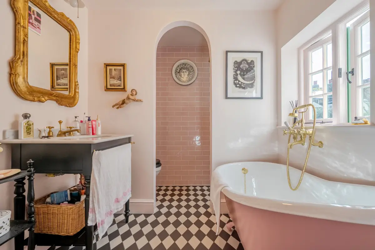 A London Family Home with a Pink deVOL Kitchen and Mint-Green Floorboards 13 pink-bathroom-checkered-floor-freestanding-bath