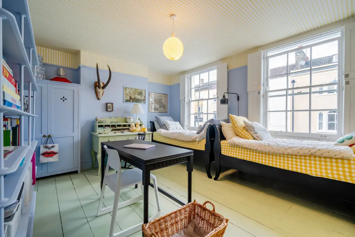 A London Family Home with a Pink deVOL Kitchen and Mint-Green Floorboards 10 shared-childrens-room-green-floorboards-striped-yellow-ceiling